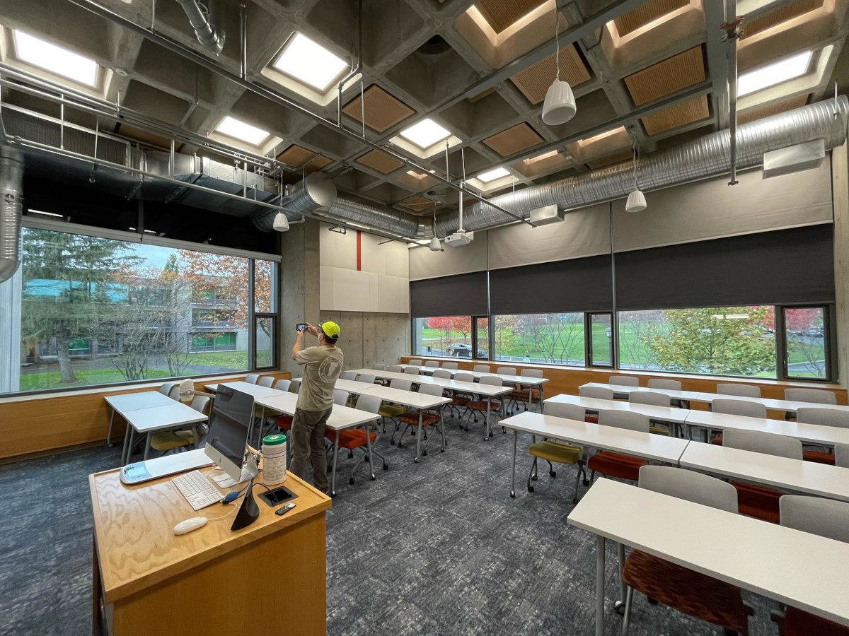 EcoSmart commercial roller shades in a school overlooking the campus