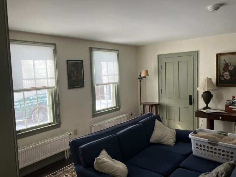 White light filtering cellular shades in a bedroom window